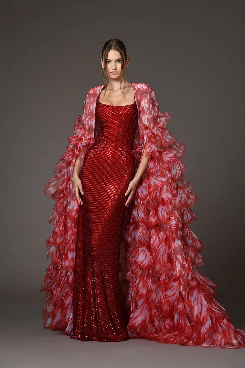 Red embellished corseted dress with a dramatic cape of overflowing laser-cut organza flower petals